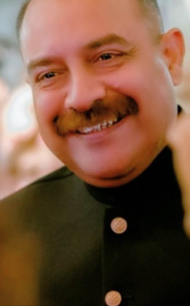 Chief Operations Professional portrait of Mr. Adnan Hafeez smiling.